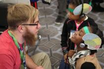 Chris Heffner with children at AAAS Family Science Days.